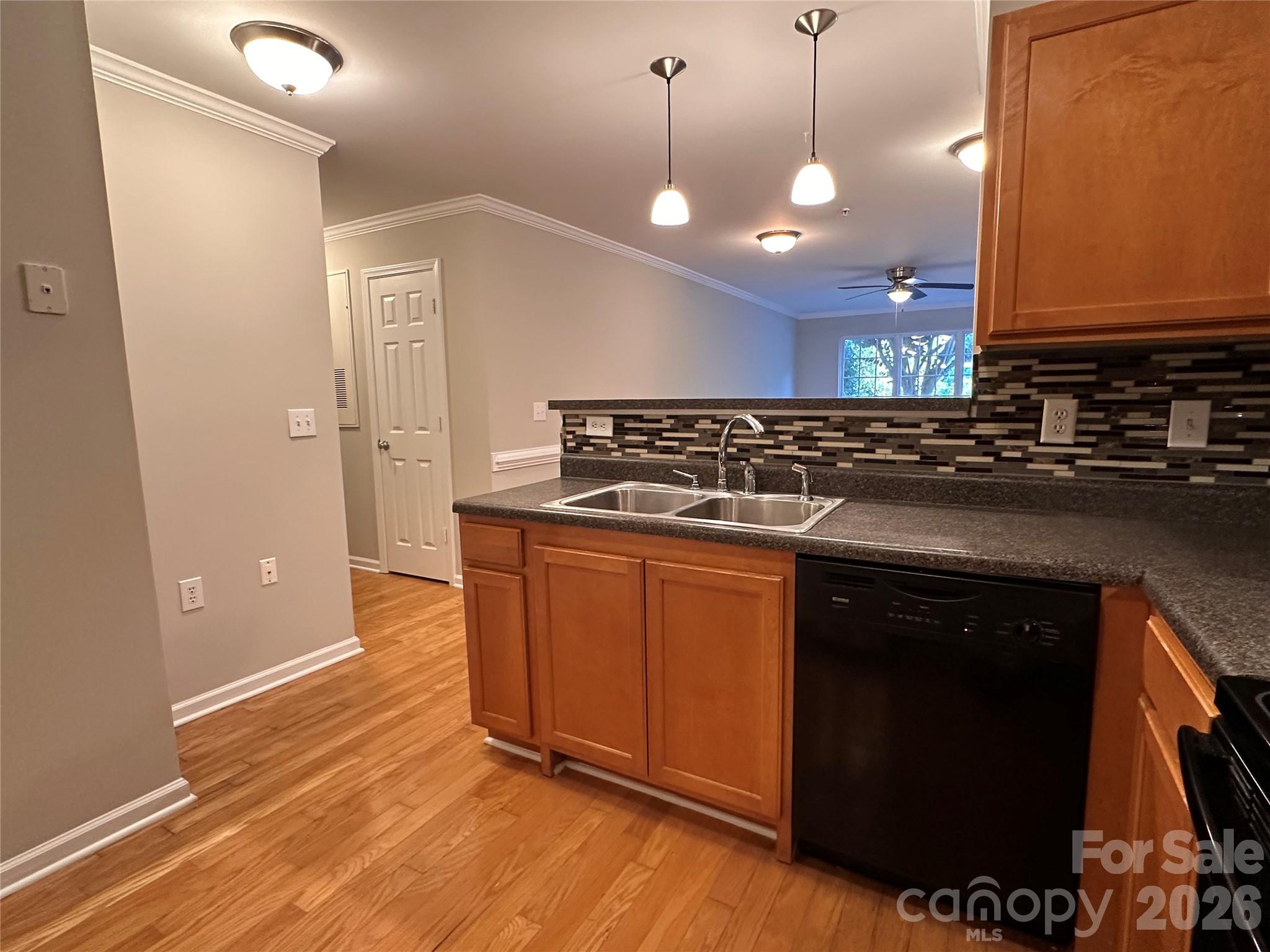 5236 Hilltop Road Jamestown, NC 27282 - Photo 10 of 32 a kitchen with stainless steel appliances granite countertop a stove a sink and a microwave