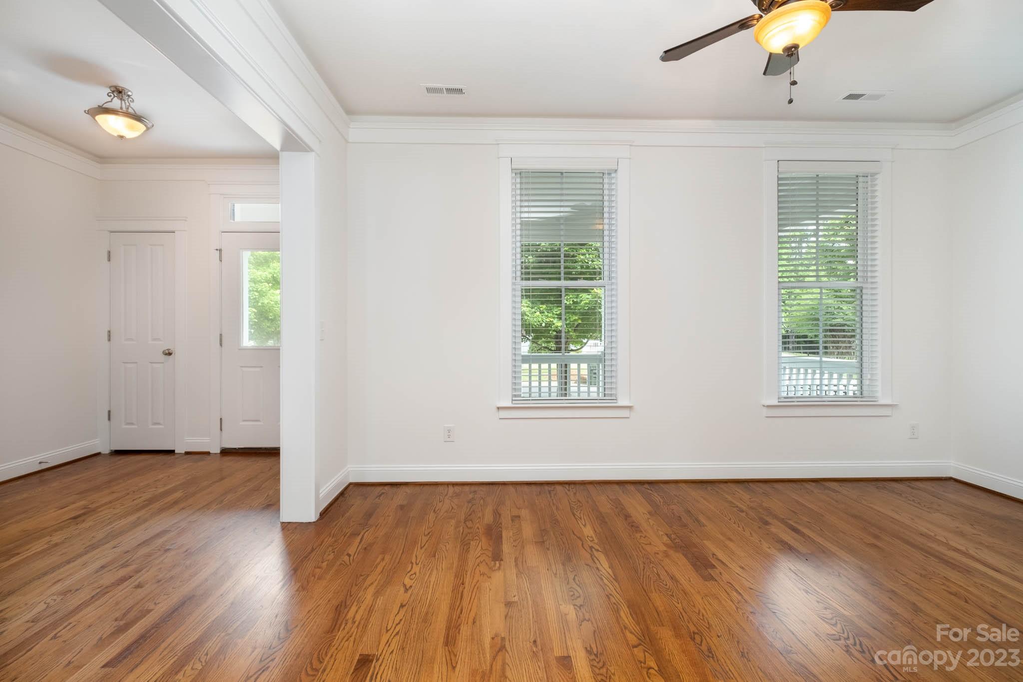 3499 Richard's Crossing Fort Mill, SC 29708 - Photo 15 of 33 wooden floor in an empty room with a window