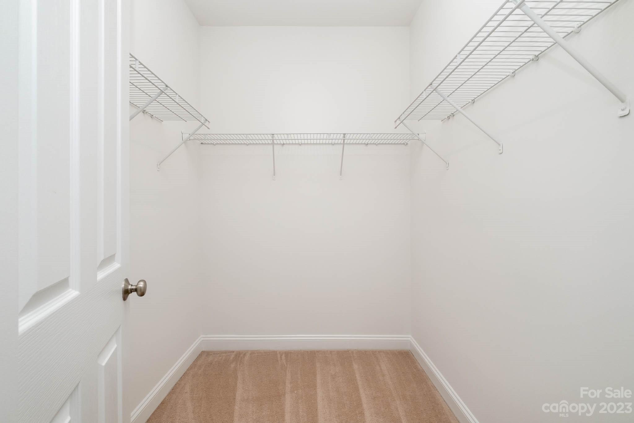 3499 Richard's Crossing Fort Mill, SC 29708 - Photo 21 of 33 a view of walk in closet with empty racks