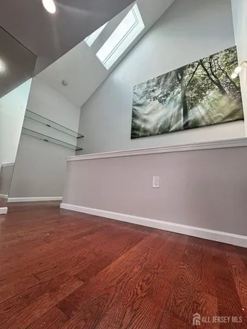 en empty room with wooden floor