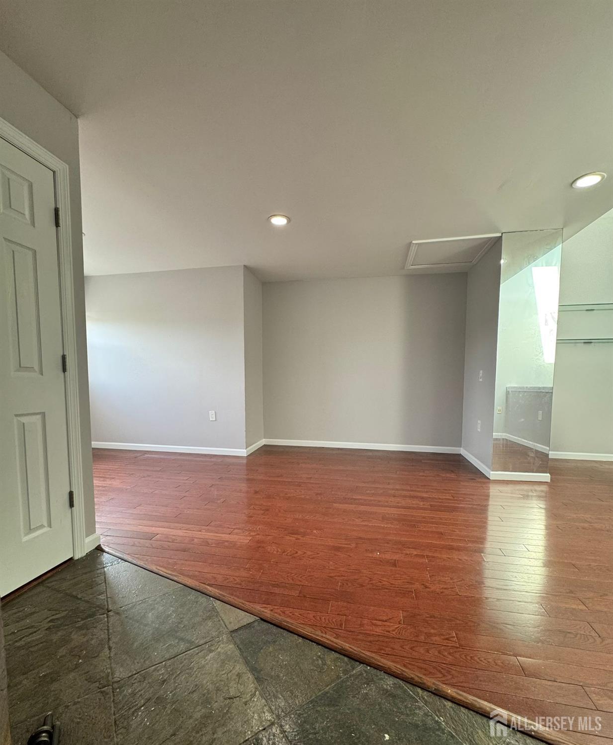 16 Jaques Street, Unit 22 Elizabeth, NJ 07201 - Photo 18 of 27 a view of an empty room with wooden floor and closet