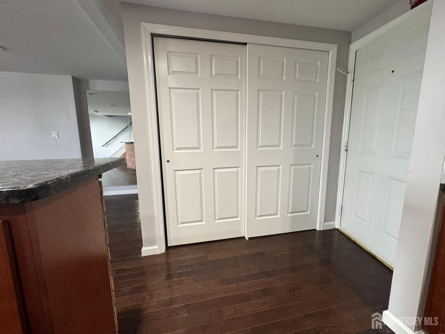 16 Jaques Street, Unit 22 Elizabeth, NJ 07201 - Photo 19 of 27 a view of empty room with wooden floor and entryway