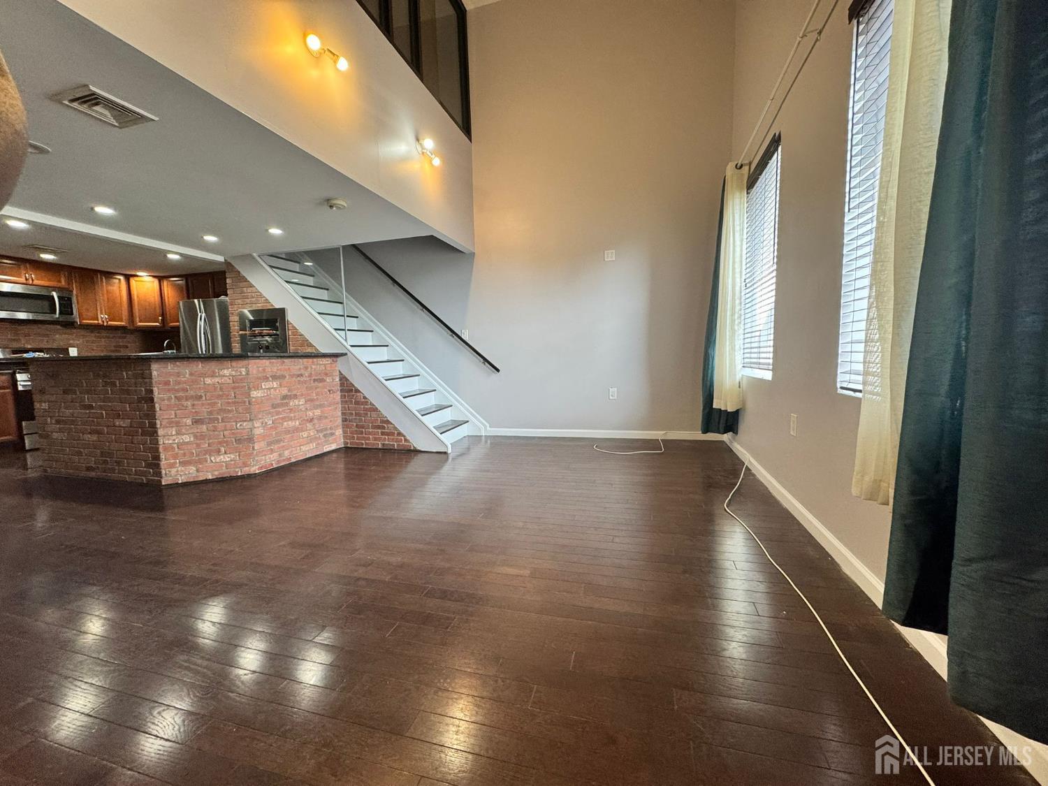 16 Jaques Street, Unit 22 Elizabeth, NJ 07201 - Photo 2 of 27 a view of an entryway with wooden floor