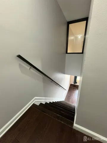 a view of entryway with wooden floor