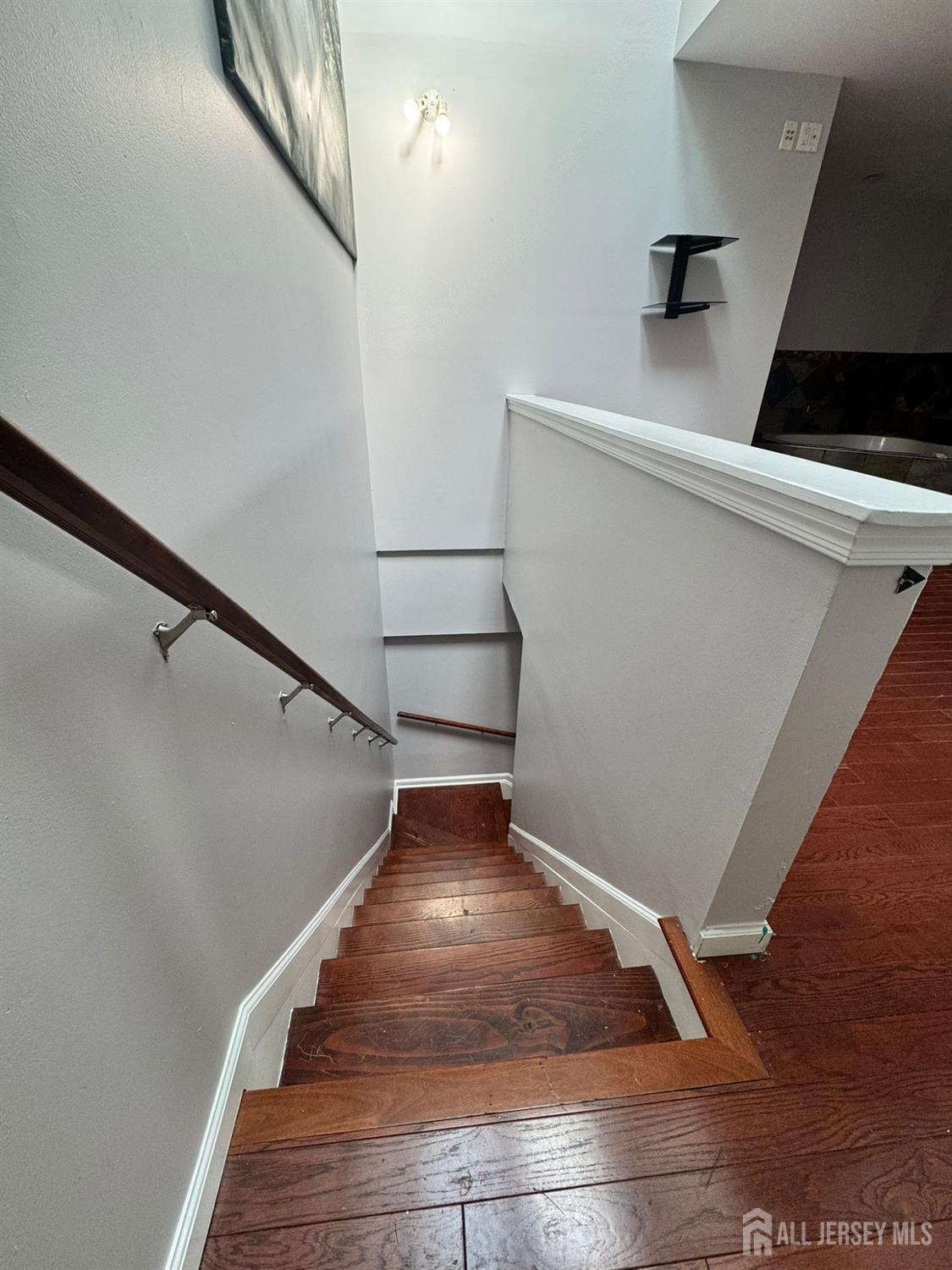 16 Jaques Street, Unit 22 Elizabeth, NJ 07201 - Photo 27 of 27 a view of a hallway with wooden floor
