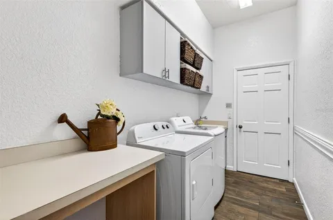 a bathroom with a toilet sink vanity and mirror