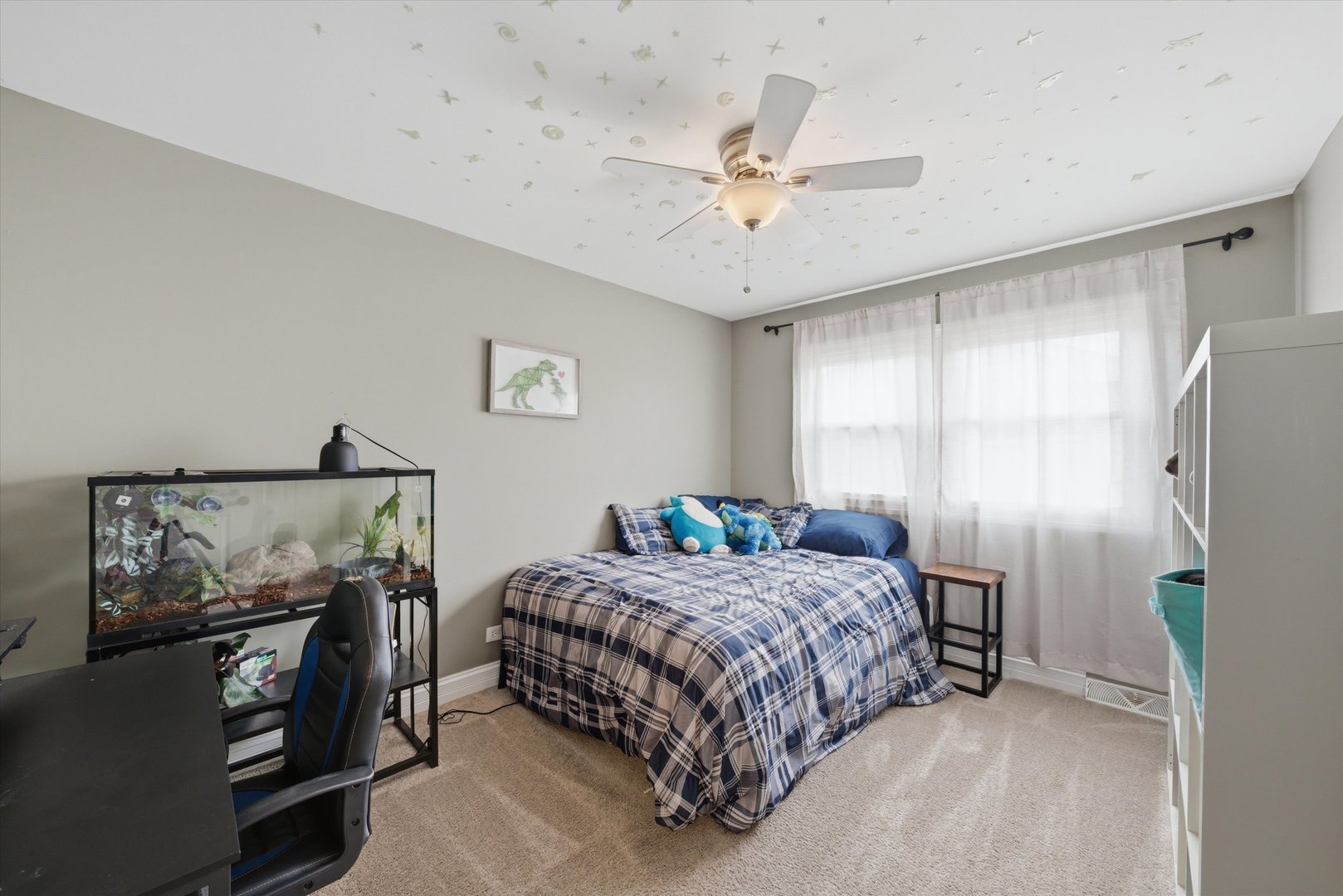 748 Ash Street Flossmoor, IL 60422 - Photo 8 of 21 a bedroom with a bed and a chandelier