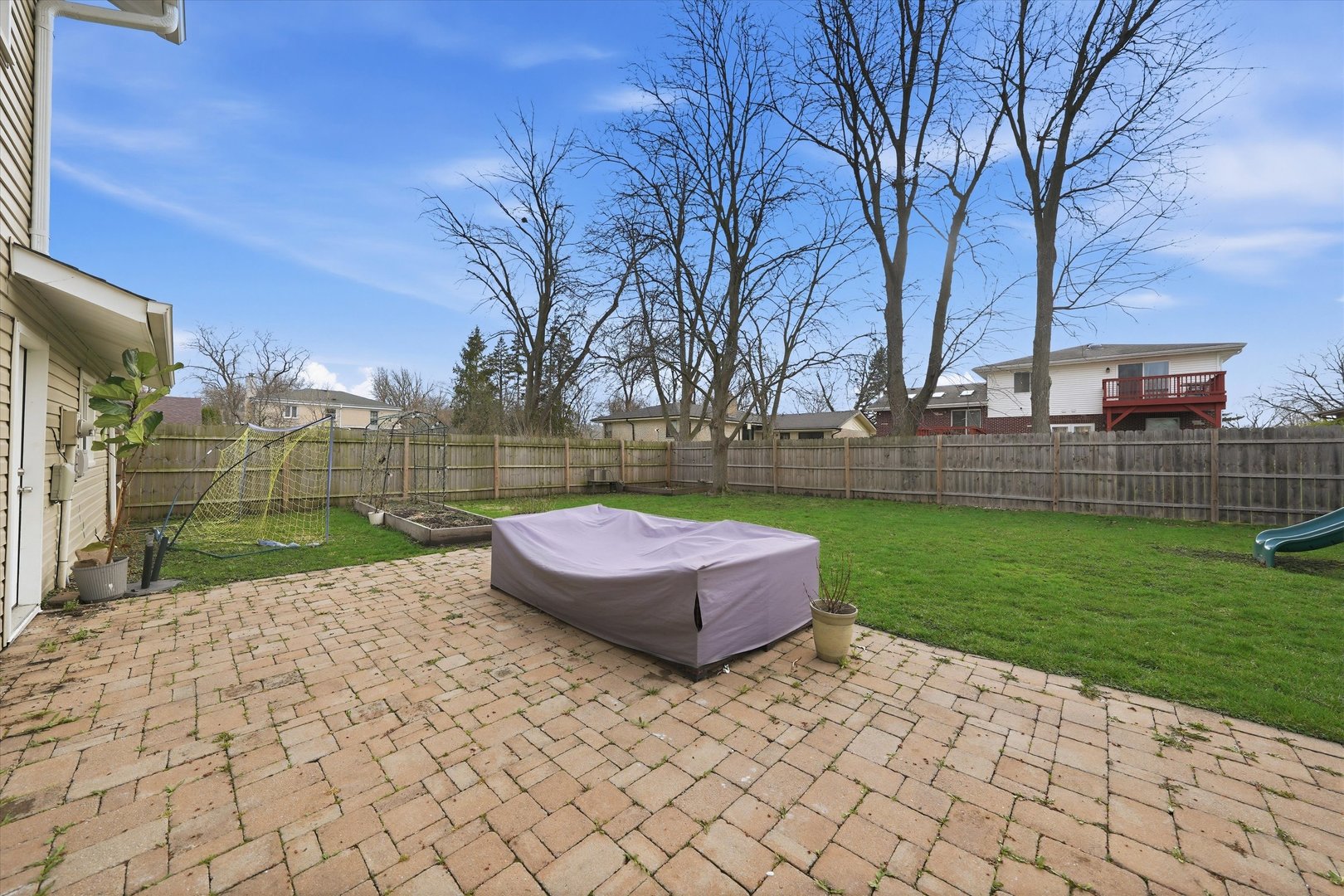 748 Ash Street Flossmoor, IL 60422 - Photo 13 of 21 a backyard of a house with lots of green space and trampoline