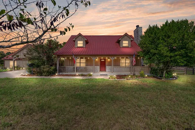 a front view of houses with yard