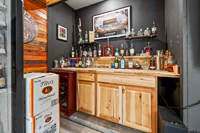 a kitchen area with granite countertop a sink and a stove top oven