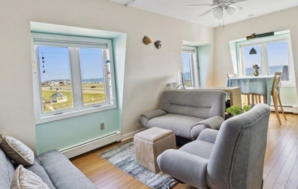 132 Bay Street, Unit 8 Hull, MA 02045 - Photo 4 of 8 a living room with furniture and a window