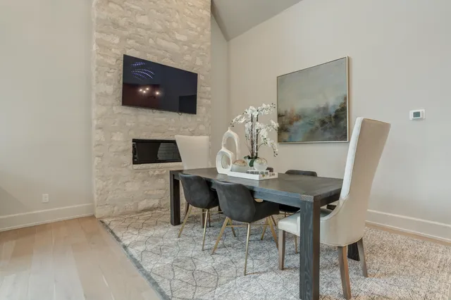 a living room with fireplace furniture and a flat screen tv