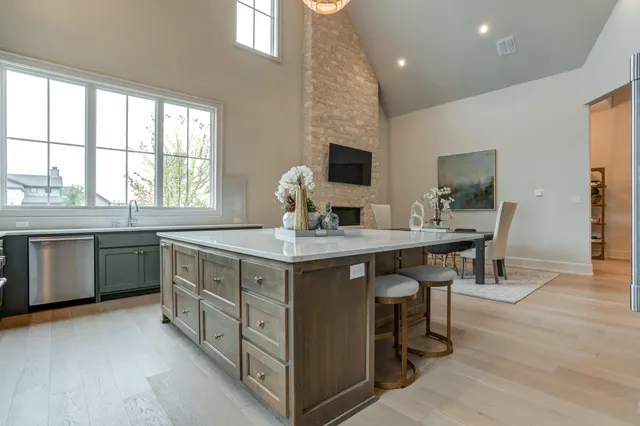 a view of white cabinets with a rug