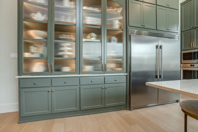 a living room with furniture gym equipment and a large window