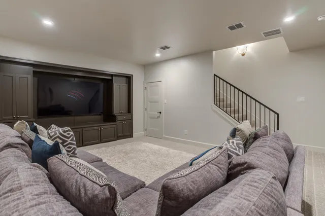 a room with a chair and a flat screen tv