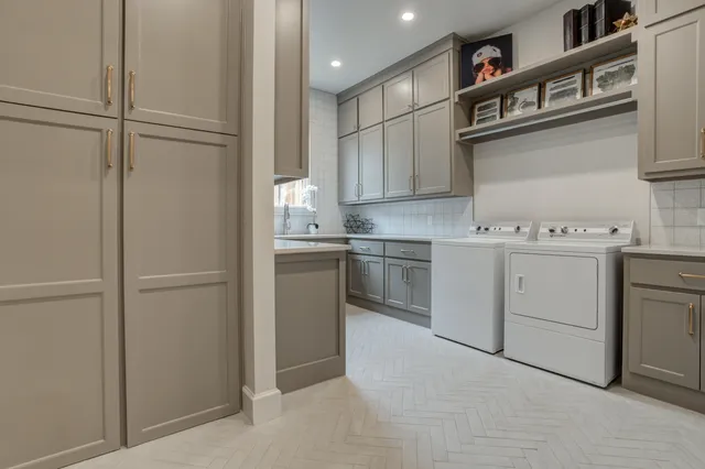 a bathroom with a granite countertop sink a toilet and a shower
