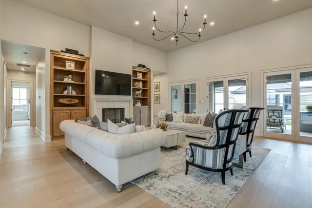 a living room with fireplace furniture and a flat screen tv