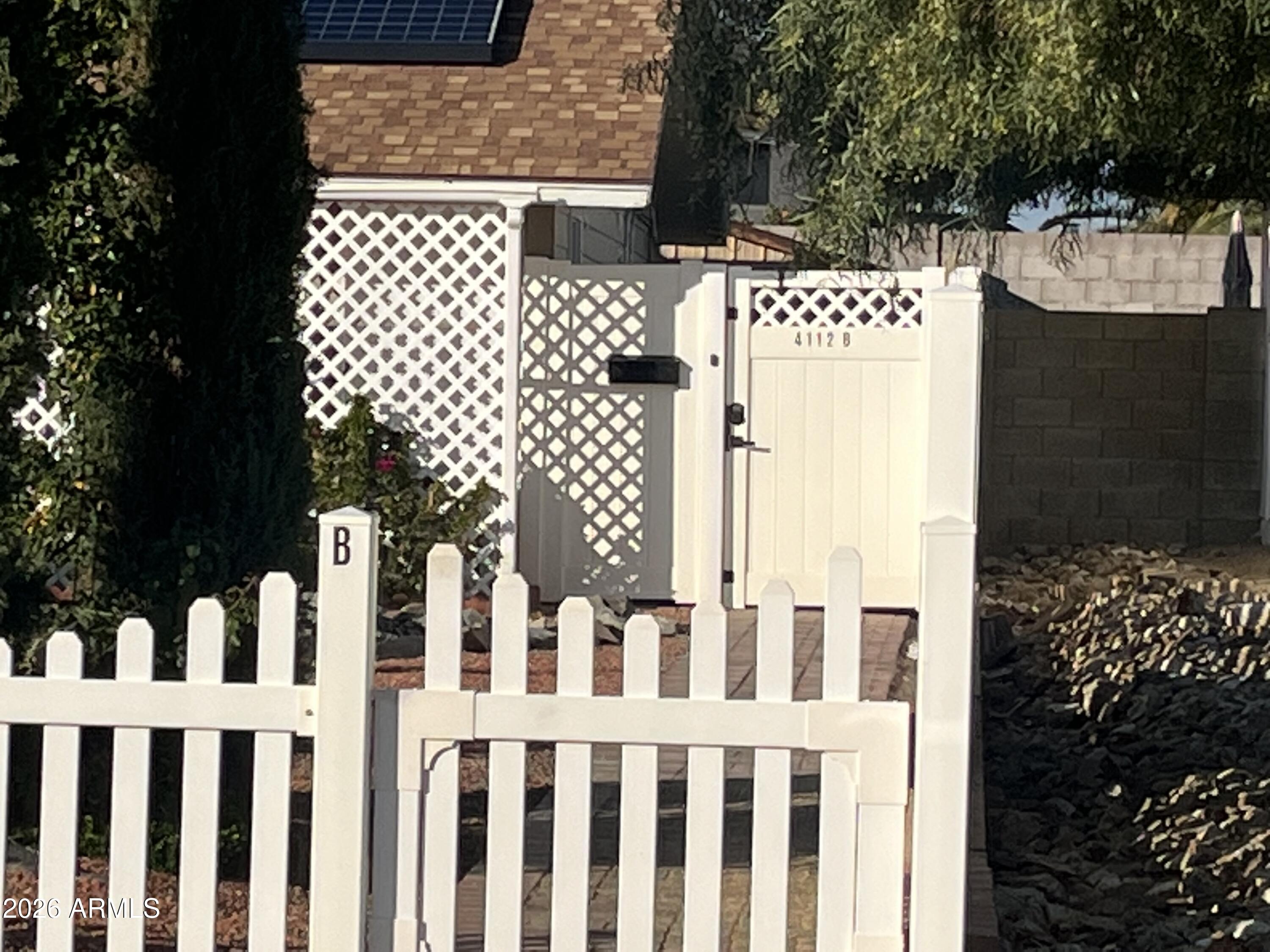 4112 West Hearn Road Phoenix, AZ 85053 - Photo 3 of 13 a view of a wooden fence