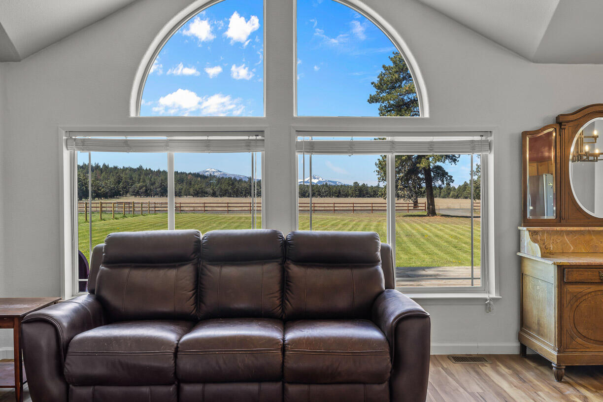 67500 Harrington Loop Road Bend, OR 97703 - Photo 14 of 72 a living room with furniture and a window
