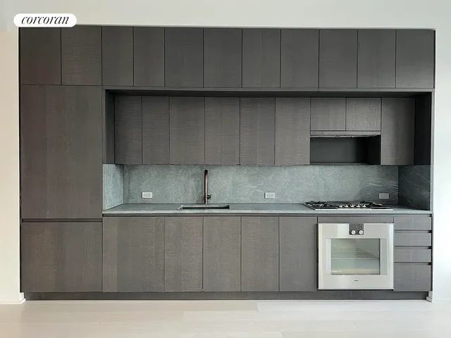 a living room with furniture a window and a table