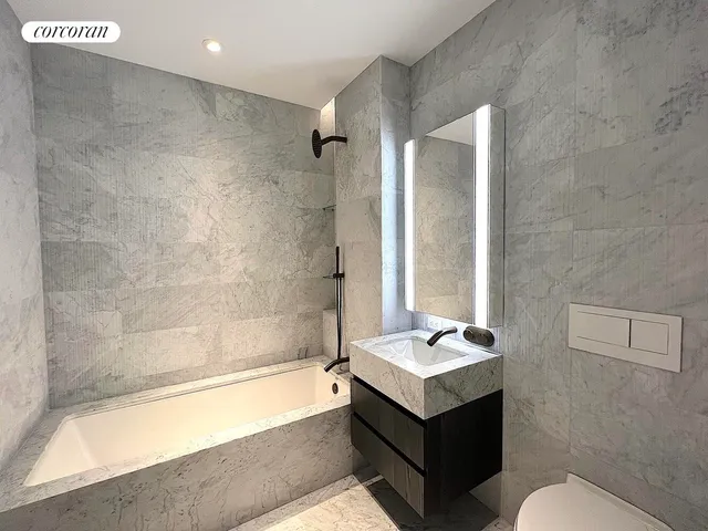 a spacious bedroom with a bed and a large window