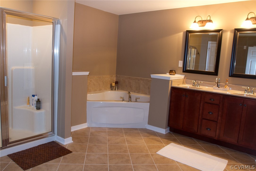 11019 Avening Road Chesterfield, VA 23832 - Photo 13 of 14 a bathroom with a tub sink and mirror