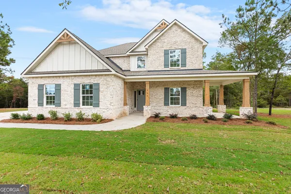 front view of a house with a yard