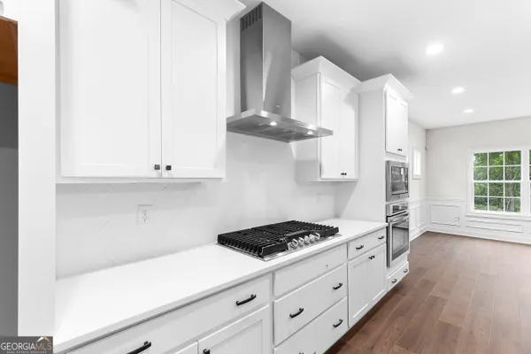 a very nice looking room with wooden floor