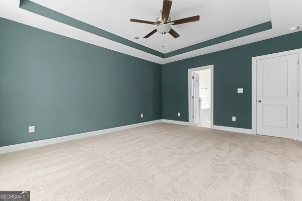 a white bath tub sitting next to a window