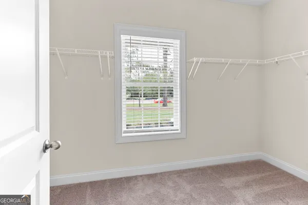 a view of a hallway with windows