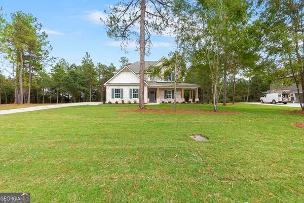 a view of a house with a big yard