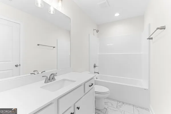 a house with swimming pool in front of it