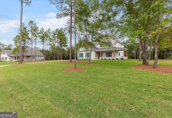 a front view of a house with a yard