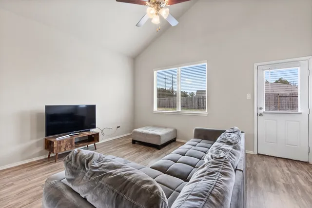 a view of a dining room with furniture and wooden floor
