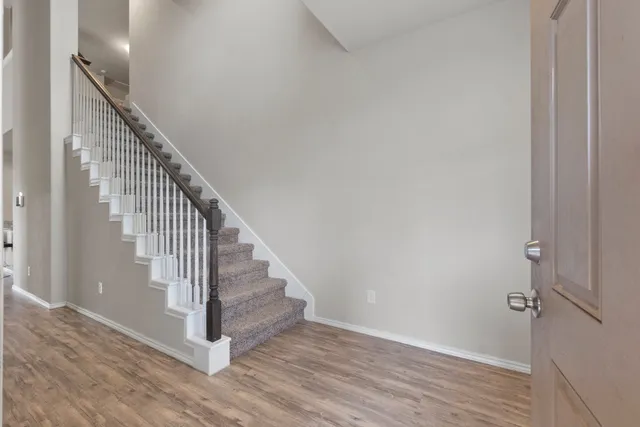 a view of entryway with wooden floor