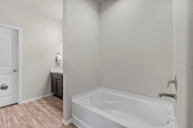 a bathroom that has a glass shower door