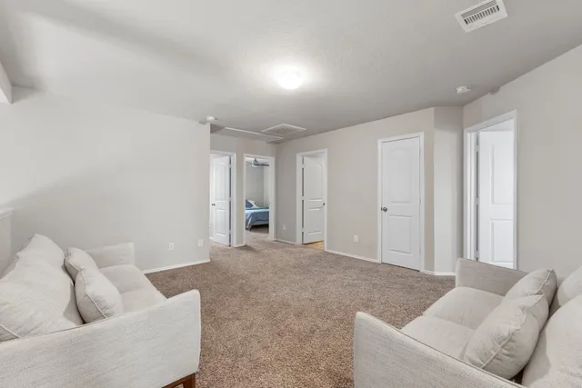 a living room with furniture and a couch
