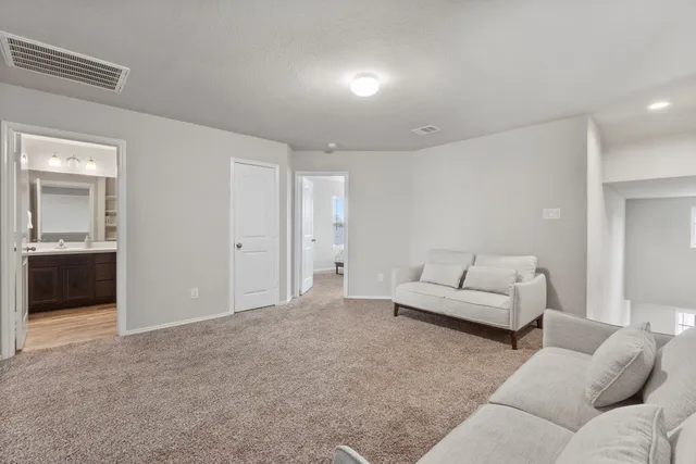 a living room with furniture and a couch