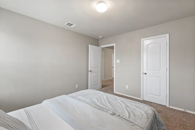 an empty room with a window and a table