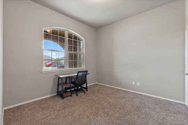 a view of a livingroom and a chair