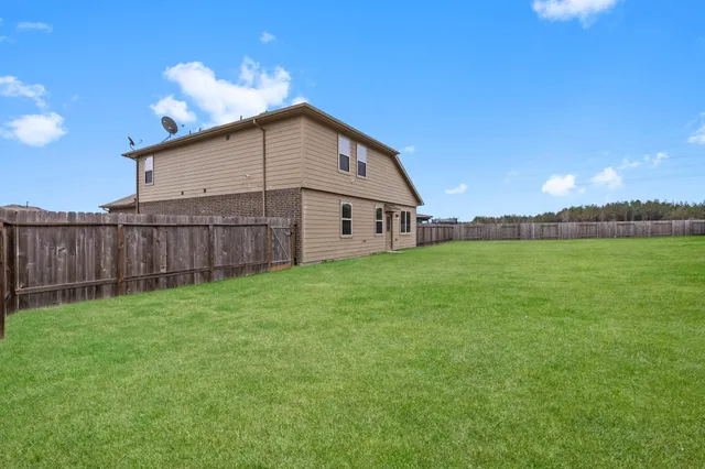 a view of a backyard with garden