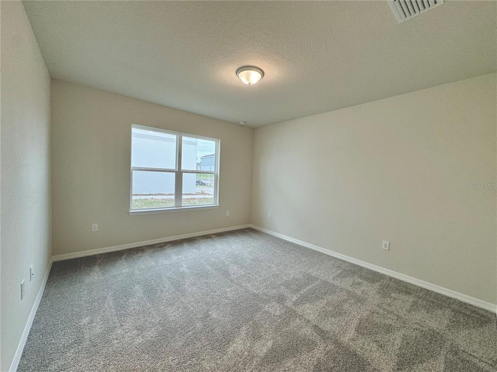 3703 Haddon Avenue Davenport, FL 33837 - Photo 12 of 23 an empty room with a window