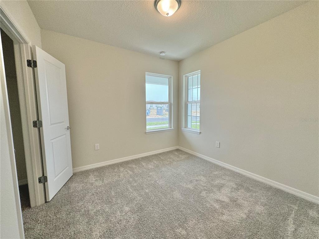 3703 Haddon Avenue Davenport, FL 33837 - Photo 17 of 23 an empty room with windows