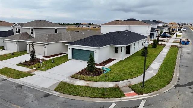 a aerial view of a house with a yard