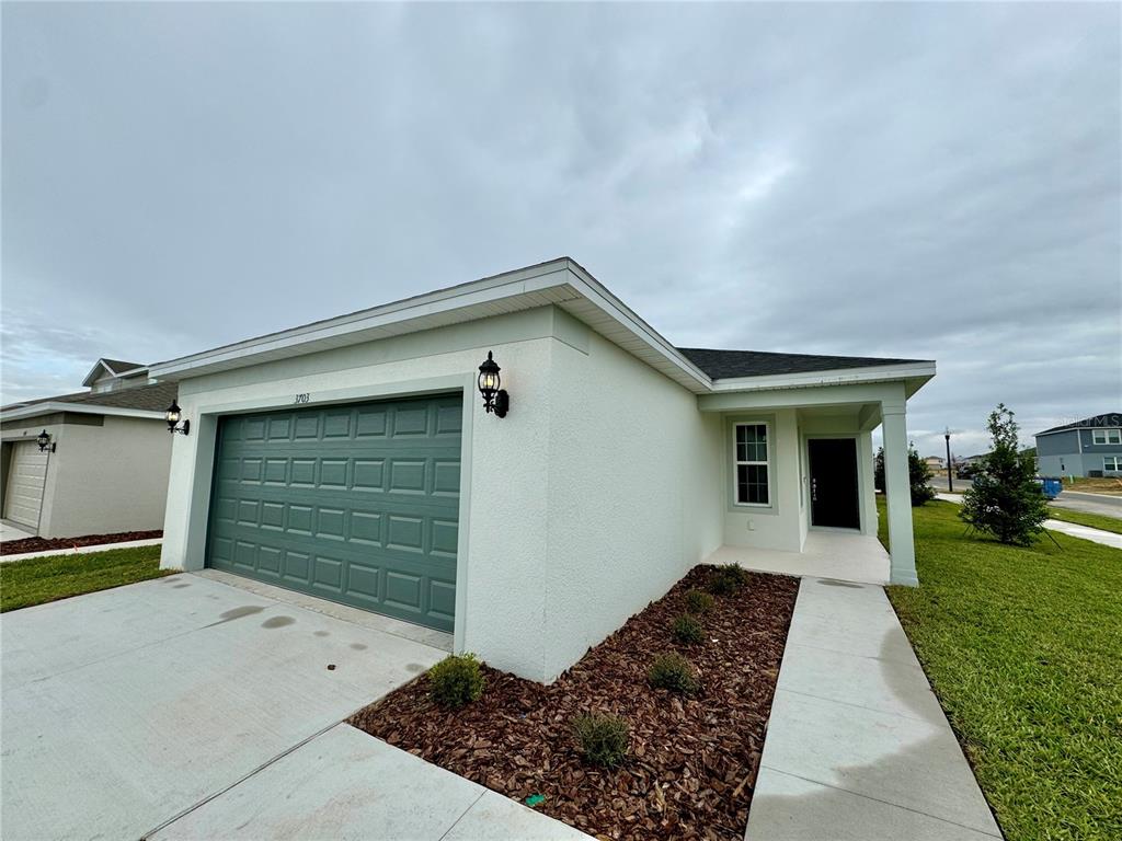 3703 Haddon Avenue Davenport, FL 33837 - Photo 4 of 23 a front view of house with yard