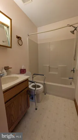a bathroom with a sink toilet and vanity