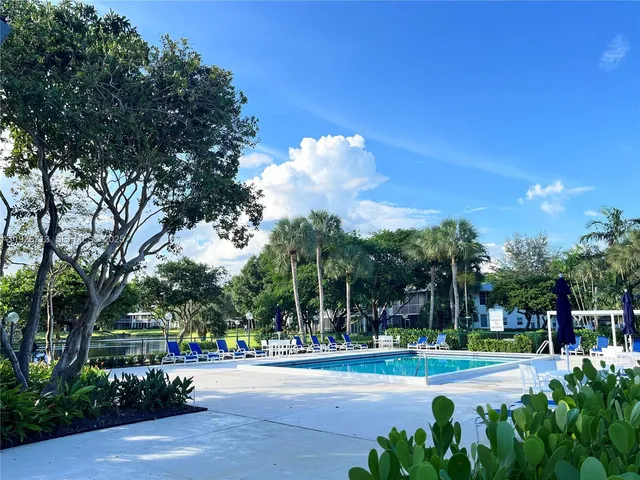 a view of a playground with basketball court