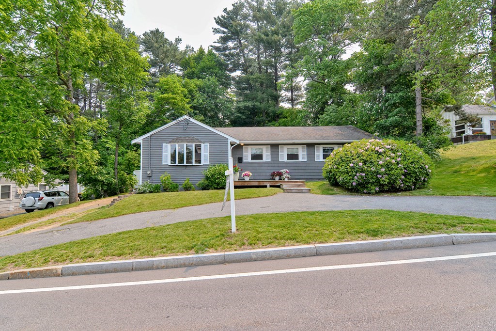 211 Beacon Street Framingham, MA 01701 - Photo 2 of 42 a house with a garden and a trees