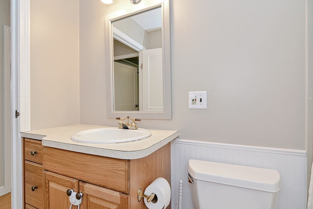 211 Beacon Street Framingham, MA 01701 - Photo 22 of 42 a bathroom with a sink and a toilet