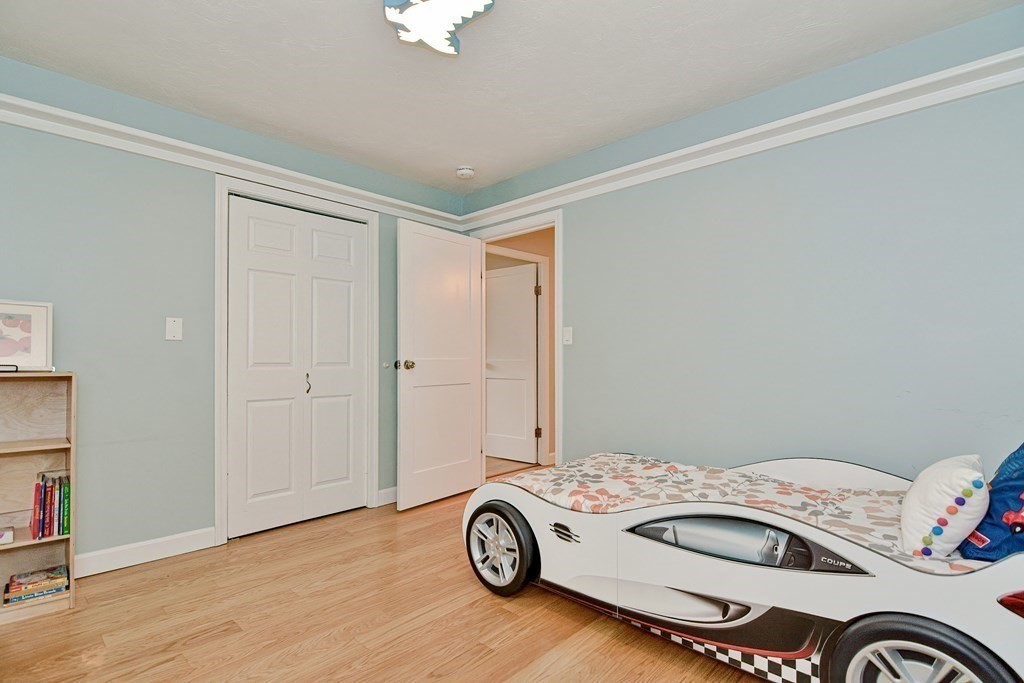 211 Beacon Street Framingham, MA 01701 - Photo 24 of 42 a bedroom with a bed and a window